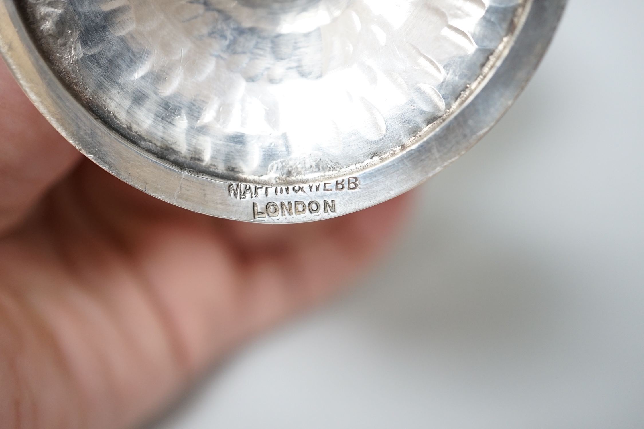 An Edwardian planished silver champagne coupe, makers Mappin & Webb, London 1903, 145 grams